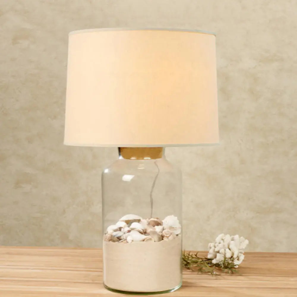 White Traditional Night Table Lamp With Clear Glass Base And Fabric Barrel Shade