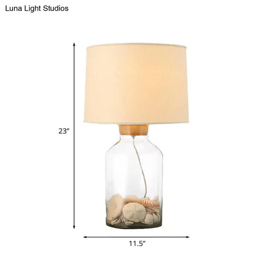 White Traditional Night Table Lamp With Clear Glass Base And Fabric Barrel Shade