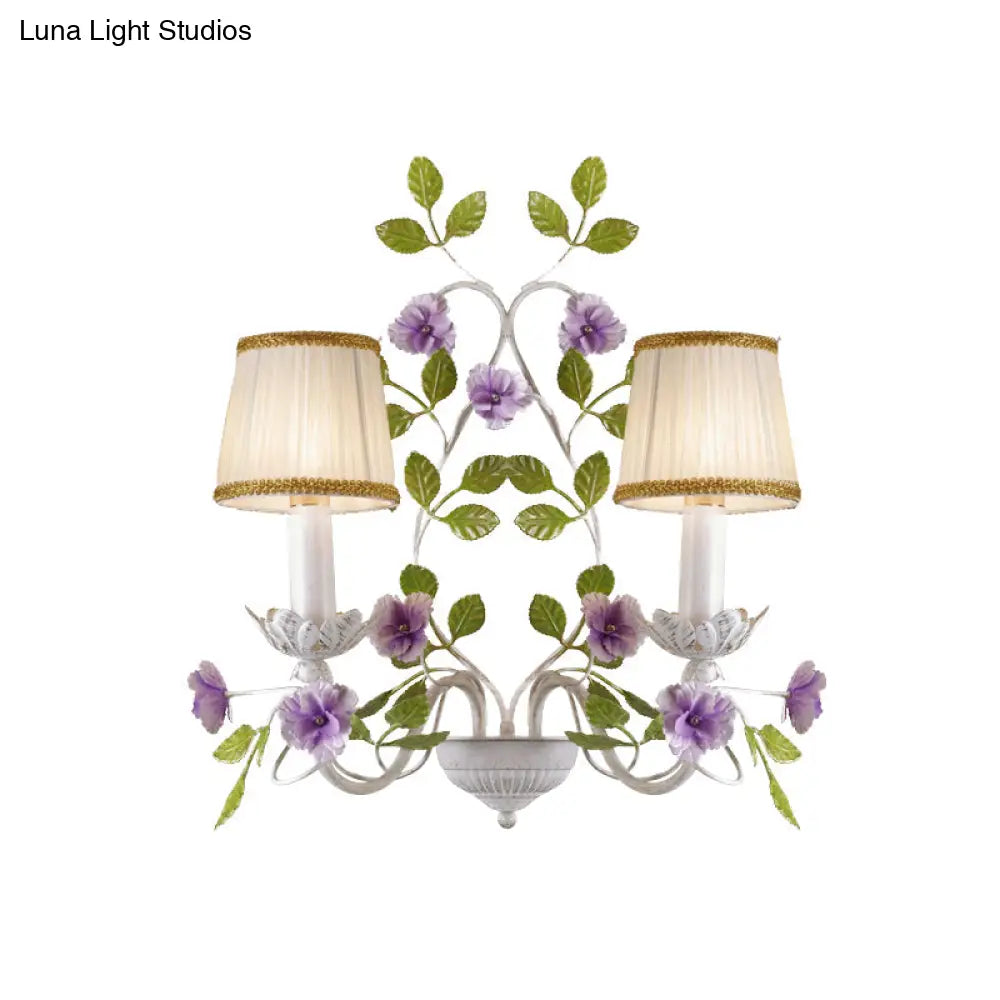 White Wall Sconce With Purple Flower Design And Pleated Shade For Bedroom Decor