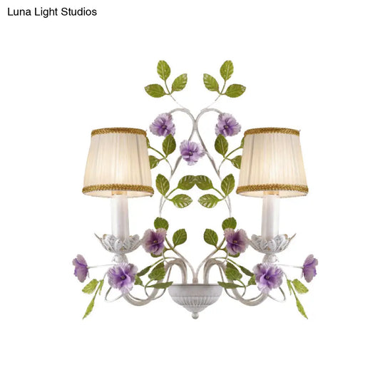 White Wall Sconce With Purple Flower Design And Pleated Shade For Bedroom Decor