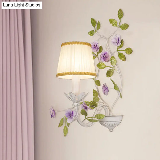 White Wall Sconce With Purple Flower Design And Pleated Shade For Bedroom Decor