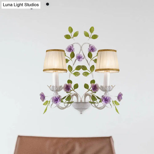 White Wall Sconce With Purple Flower Design And Pleated Shade For Bedroom Decor