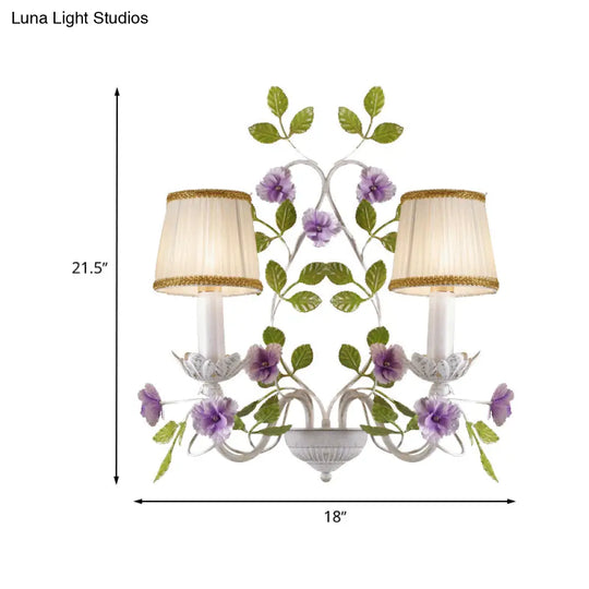 White Wall Sconce With Purple Flower Design And Pleated Shade For Bedroom Decor