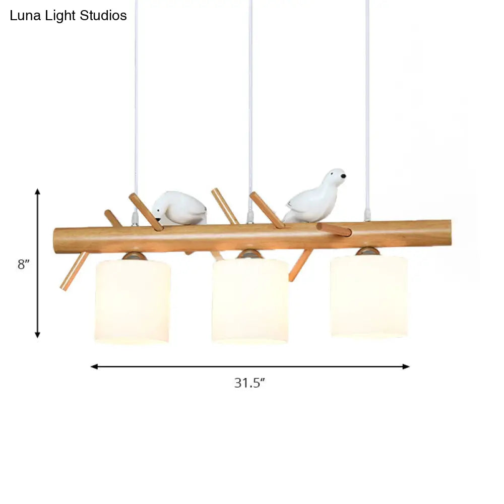 Wooden Hanging Chandelier With 2/3 Lights Glass Cylinder Shade And Bird Décor - Ideal For Dining