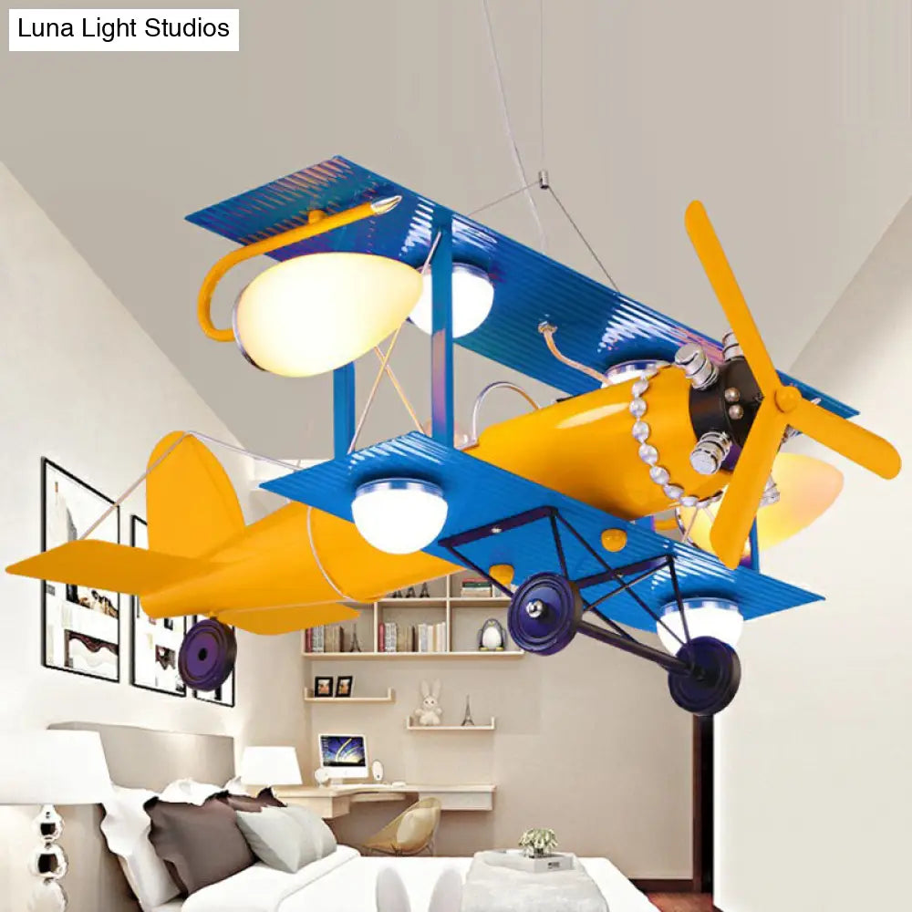 Yellow Led Nursery Chandelier With Jet Plane Design And Cream Glass Shade