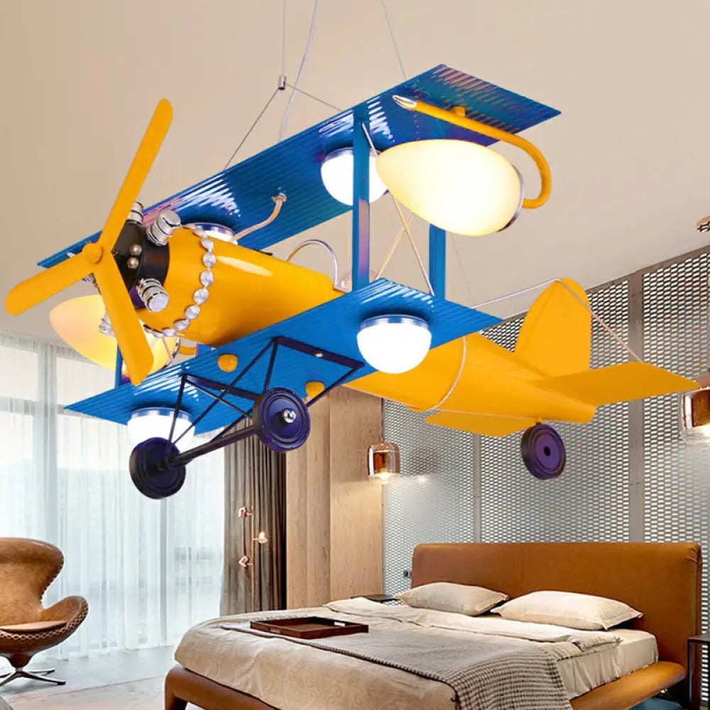 Yellow Led Nursery Chandelier With Jet Plane Design And Cream Glass Shade