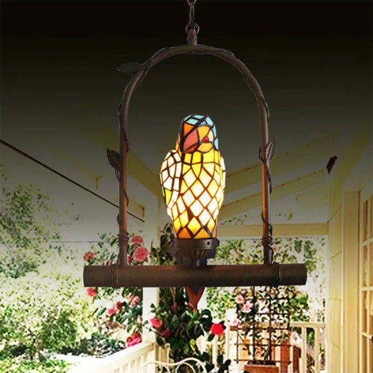 Yellow Stained Glass Victorian Parrot Wall Light With Swing - Mediterranean Style 1-Light Sconce